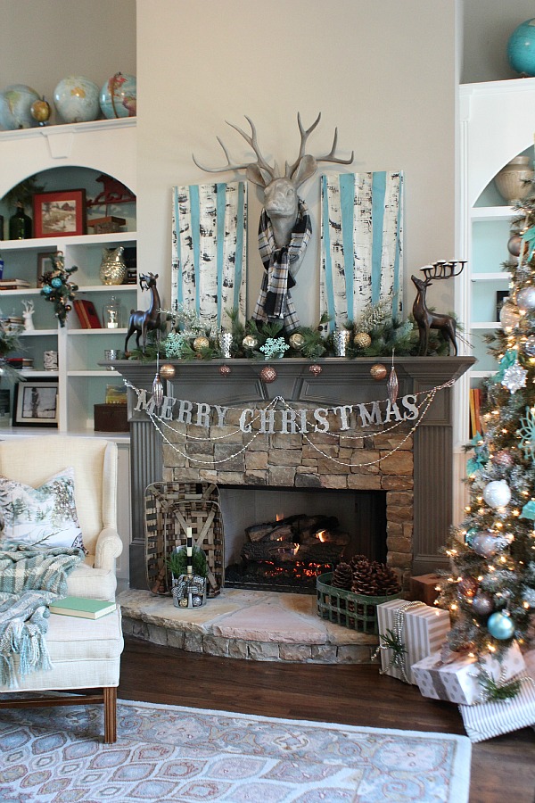 https://houseofturquoise.com/wp-content/uploads/2015/12/Living-room-fireplace-ready-for-Christmas-in-blues-1.jpg